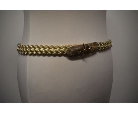 A vintage silver tone metal braided belt.