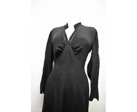 An Art deco 1930s day dress in black, simple, yet effective details thoughout, such as pin tucks, ladder work and panels to s