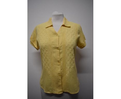 A 1940s lemon yellow blouse in a linen-like fabric, having extensive embroidery to front and turn-ups to cuffs.