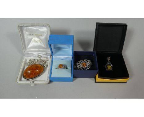A Collection of Silver Mounted Amber Jewellery to Include Brooch, Ring, Two Pendants 