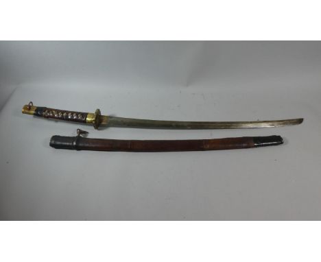 A WWII Japanese Katana Sword with Leather Scabbard, Engraved Tsuba, Leather and Shagreen Handle, In Need of Some Restoration,