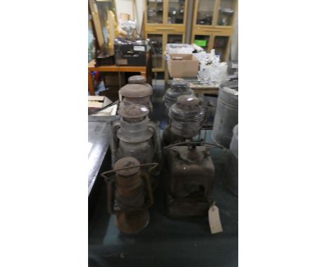 A Collection of Seven Vintage Hurricane Lamps 