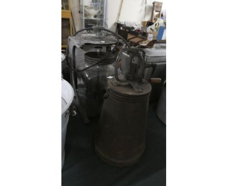 A Vintage Electric Powered Blow Butter Churn Together with a Metal Hand Operated Example 