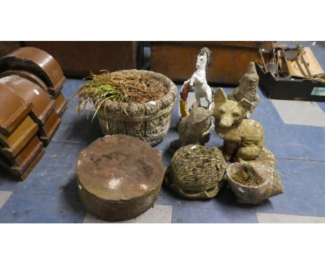 A Collection of Various Garden and Patio Ornaments, Grindstone and Planter 