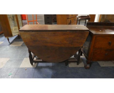 A Period Oak Drop Leaf Gate Legged Table with Oval Top, 106cm Long 