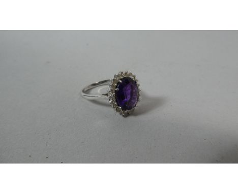 A Tanzanite and Diamond Mounted White Metal Ring, Hallmark Unclear 
