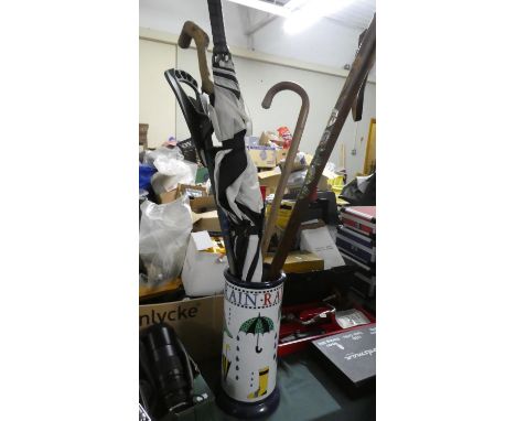 A Ceramic Stick and Umbrella Stand with Contents 