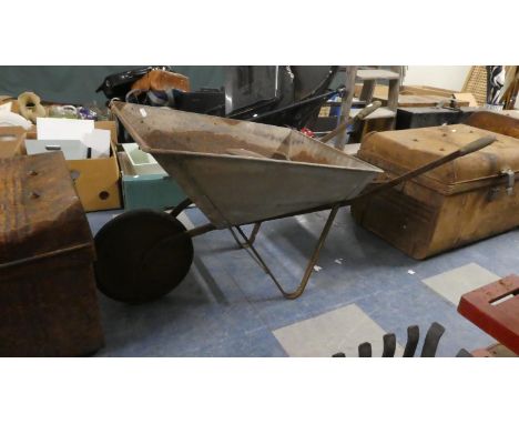 A Vintage Garden Wheel Barrow and Shoe Last 