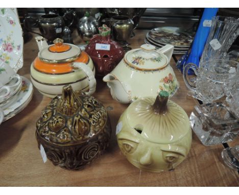 A selection of ceramic tea pots and lidded jars