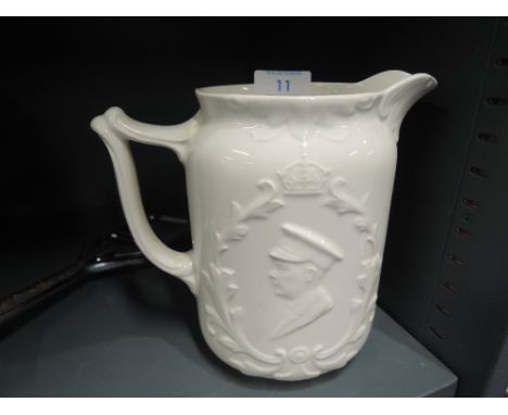 A cream glaze ceramic decanter by Coronet ware with military decal and dated 1937