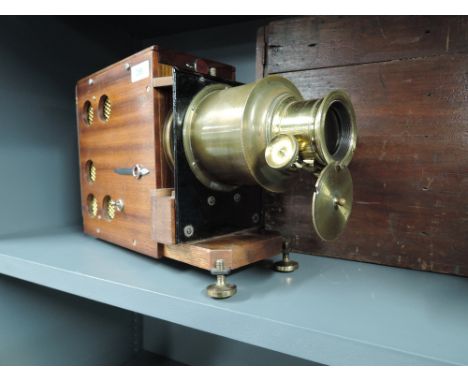 An Aldis wooden bodied magic lantern projector with brass lens and wooden case15CM 20CM X 35CMGOOD NO SCRATCHES OR DENTS, POS