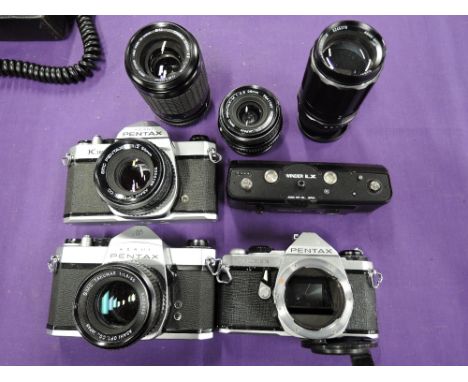 Three Pentax cameras and lenses etc. A Pentax K1000, a Pentax MLE Super, a Pentax SP1000, a Pentax winder ILX, a Takumar 1;3,