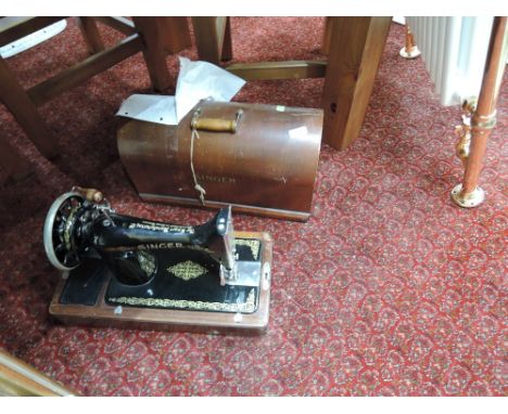 A vintage singer hand cranked sewing machine