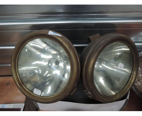 Two large brass bodied motor or engine lights
