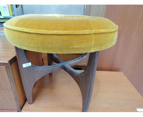 A vintage teak dressing table stool