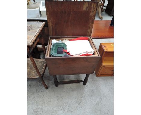 A vintage mahogany sewing box and contents