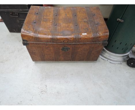 A vintage Japanned tin travel trunk