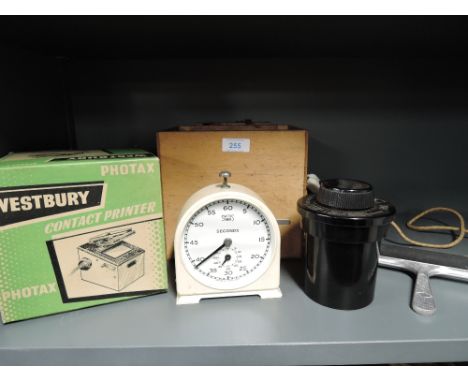 A selection of photographic equipment including a Photax Westbury contact printer, a home made light box, a Paterson Major ta