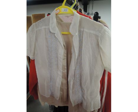 Two pretty vintage 1950s blouses, both will need buttons and one has holes to underarms. Small sizes.
