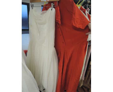 Two vintage dresses, red 50s dress has large collar and pocket detailing, this has repairs to underarm and some holes through