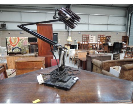 A vintage angle poise lamp having phenolic bulb holder
