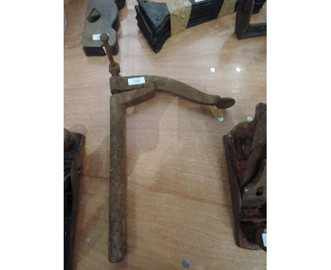 a vintage woodworkers bench vice or clamp