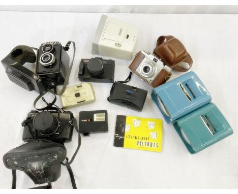 Rolleiflex SL35M case with instruction manuals and a Lubitel 2 camera case, a Prontor-SVS sillette camera in leather pitted c