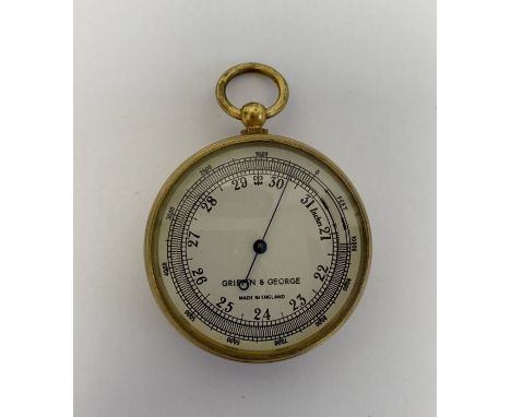 Edwardian gilt-metal pocket barometer by Griffin & George, with silvered dial, 4.7cm diam. 