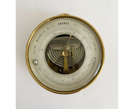 Naduet brass cased skeleton holosteric barometer, the silvered dial applied with fahrenheit thermometer, 13cm diam.