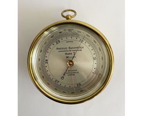 Edwardian gilt brass mounted aneroid barometer by T Wheeler (London), the silvered dial named MARK I, numbered 12532/42, the 