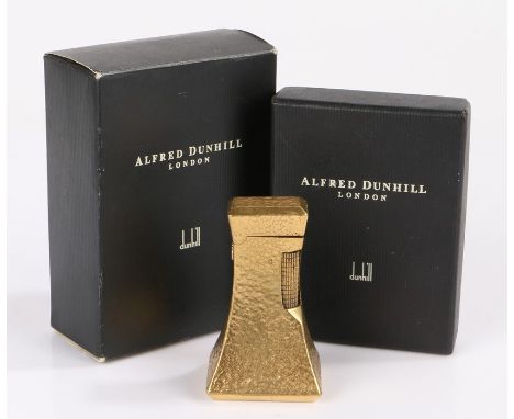 Dunhill London "Wheatsheaf" table lighter, the gold plated tapering body with beaten decoration, 7cm high