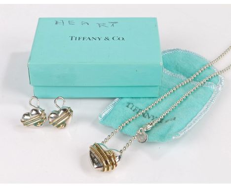 Tiffany &amp; Co pendant in the form of a heart with a arrow wrapped around the side, dated 1994, together with two earrings 