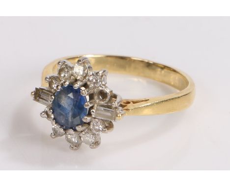 18 carat gold sapphire and diamond set ring, the central sapphire with round and baguette cut diamond surround, ring size P