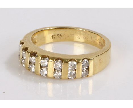 18 carat gold diamond set ring, with a dual row of round cut diamonds containing a total of fourteen diamonds, ring size N