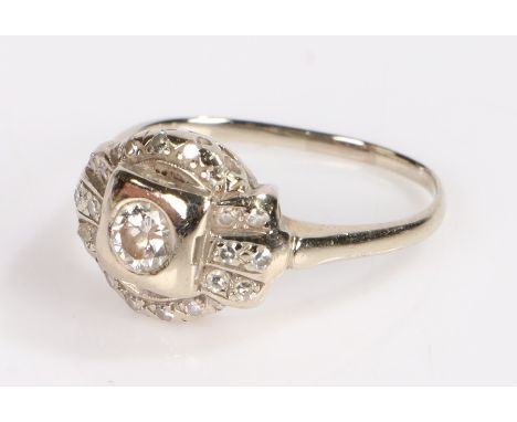 14 carat white gold diamond set ring, with a central round cut diamond to the head and a diamond surround, 3.7 grams, ring si