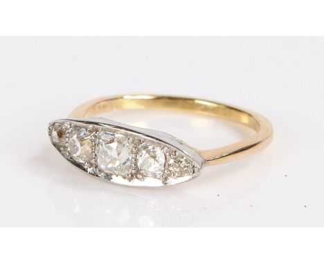 Diamond set ring, with five round cut diamonds to the platinum head set to a yellow metal shank, 2.9 grams, ring size N