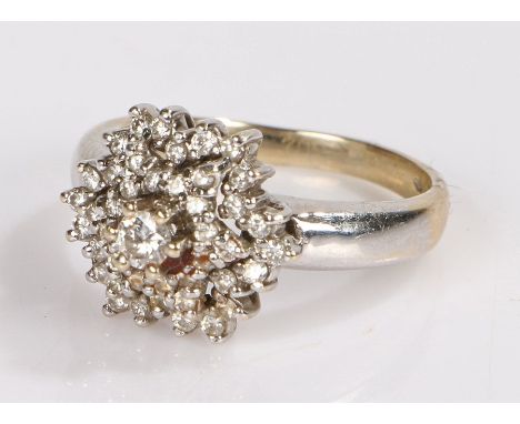 18 carat white and yellow gold diamond set ring, with a central diamond and star diamond set surrounds, ring size R