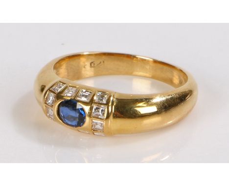 18 carat gold sapphire and diamond set ring, with a central sapphire and a twelve diamond surround, ring size L