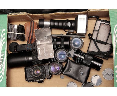 Canon Lenses, an f/2.8 24mm FD, an f/3.5-4.5 35-70 FD with other lenses a tripod and other accessories (a lot)