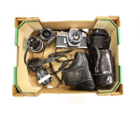 A Minolta SRT101 SLR Camera, together with f/1.7 55mm, f/2.8 35mm and f/2.8 135mm lenses (a lot)