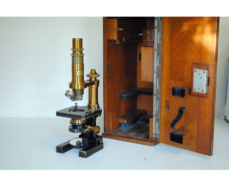 A Brass & Laquer Carl Zeiss Microscope, with various eyepieces and objectives, in mahogany case