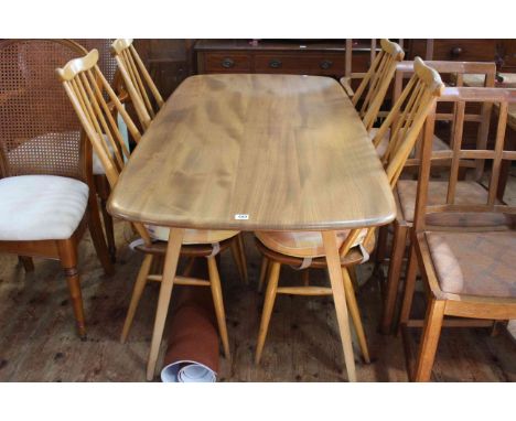 Ercol Windsor rectangular dining table, 72cm high by 157cm long by 77cm wide, together with four spoke back chairs.