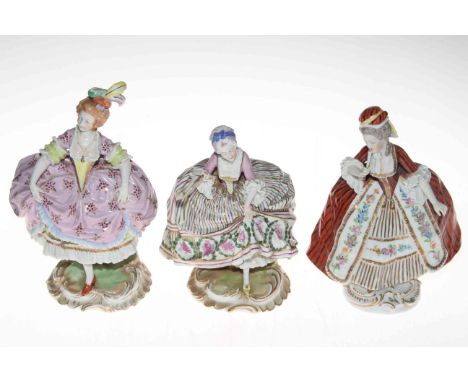 Pair of Sitzendorf porcelain crinoline ladies together with a third similar figure, tallest 23cm, blue mark (3).