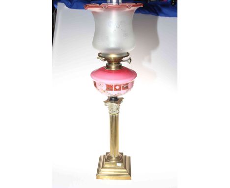 Victorian brass square reeded column oil lamp with an etched shade and a pink reservoir, 78cm high.