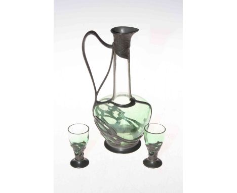 Art Nouveau pewter mounted glass ewer, 21cm high, and two glasses (3).