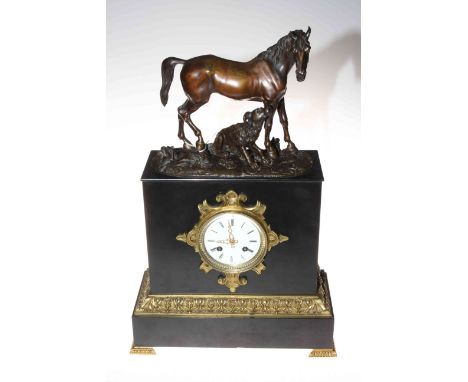 Victorian slate and brass bounded mantel clock on brass column feet depicting a horse and hound, with key, 49cm by 31cm by 13