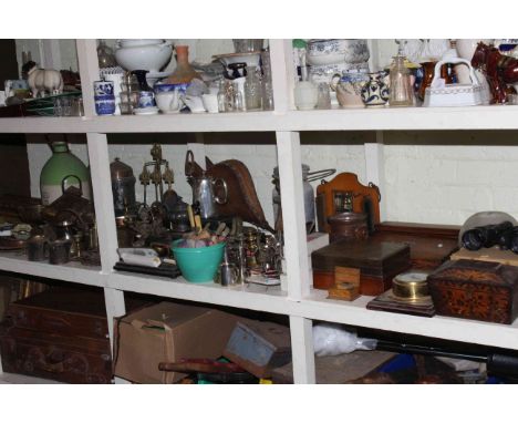 Large shelf collection of metalwares including tea caddy, writing slope, cased cutlery, oil lamp, glass chimneys, fishing ree