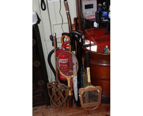 Collection of rackets, walking canes and umbrellas including Whipshaft and Slazenger rackets, horn handled cane, carpet beate