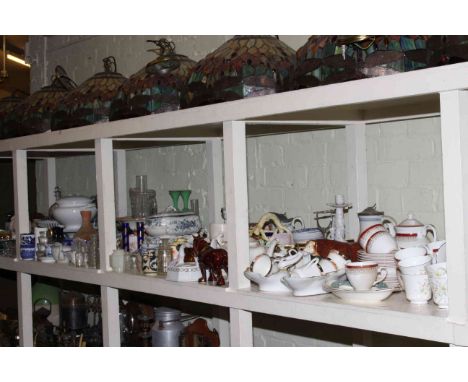 Large shelf collection including Staffordshire Dogs, Mason's soup tureen, wall tiles, ceramics, glass, fabrics, commemorative