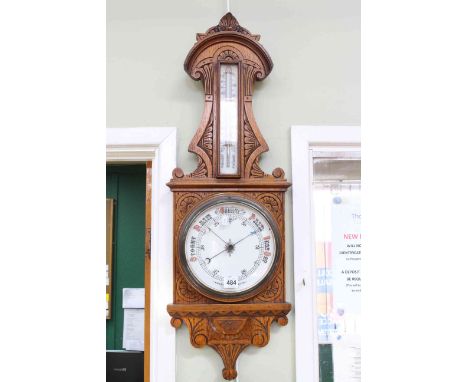 Victorian carved oak aneroid barometer-thermometer.